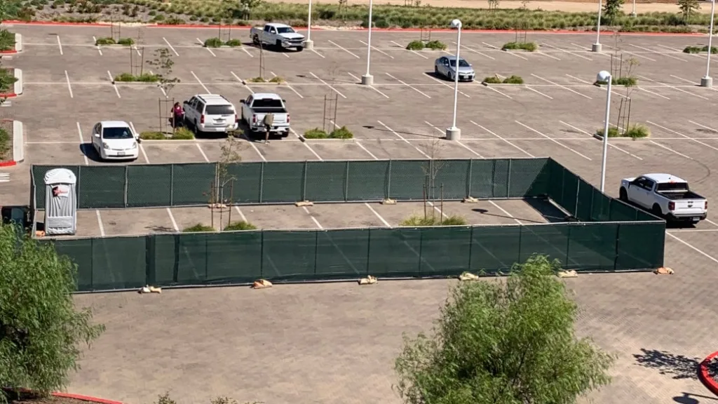 temporary fencing in a parking lot section