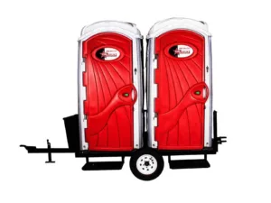 two standard toilet rentals mounted on trailer