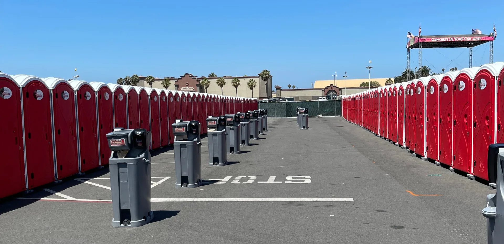 long line of portable toilets and hand washing stations by Cal-State Site Services