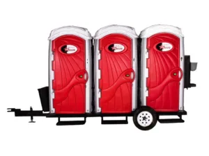 three standard toilet rentals mounted on trailer